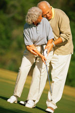 older couple golfing