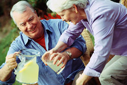 couple pouring lemonade